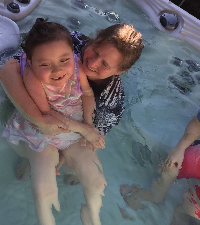 Kayla, mom and brother in hot tub