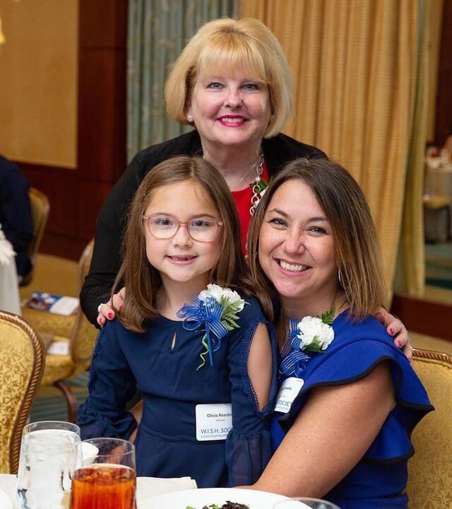 Olivia family at W.I.S.H. Society