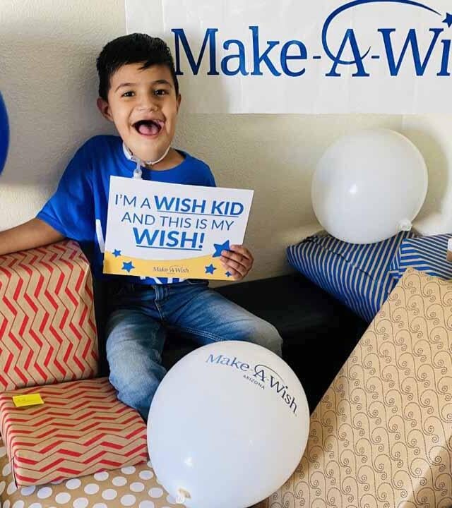 Luis is very excited to open his many wish presents! 