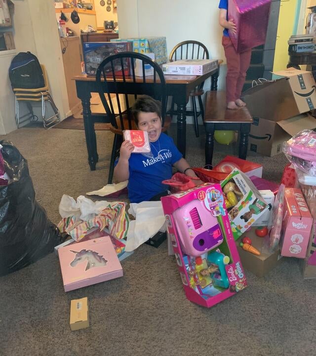 Penelope opens up her gifts from her online shopping spree wish.