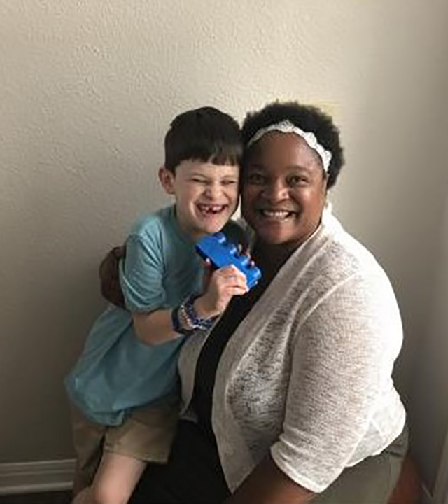Volunteer Sophia hugging Wish Kid