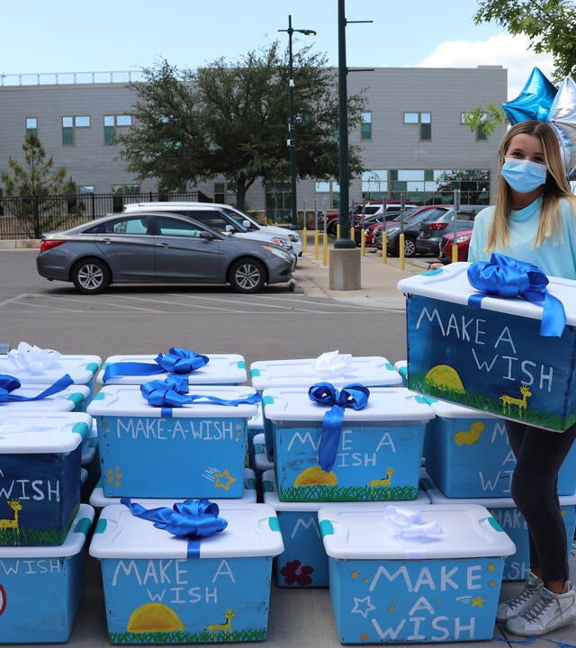 Lauren with her boxes of comfort for the kids at Dell Children's Medical Center.