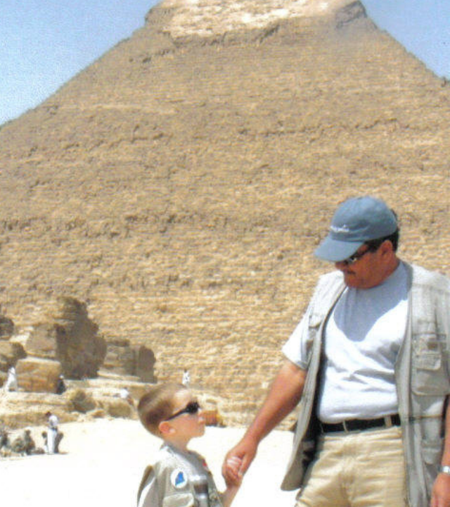 Nick stands in front of a Pyramid