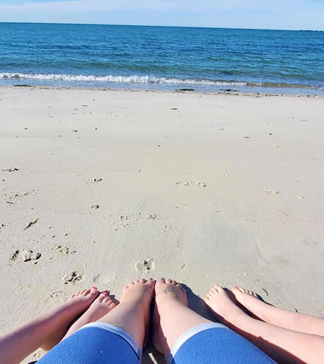 Wish Kid Skyla and family's toes in the samnd