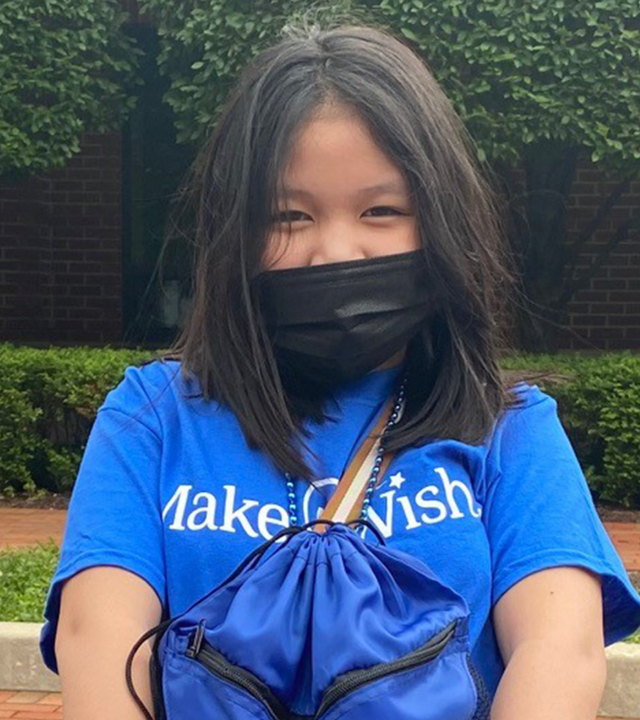 Kaylan holds one of the gift bags for homeless children