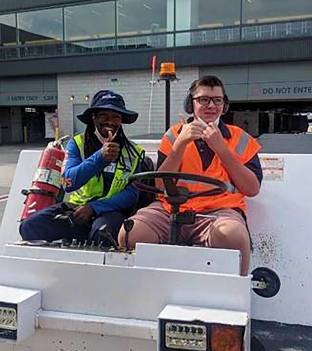 Wish Kid Cole with Jet Blue Employee