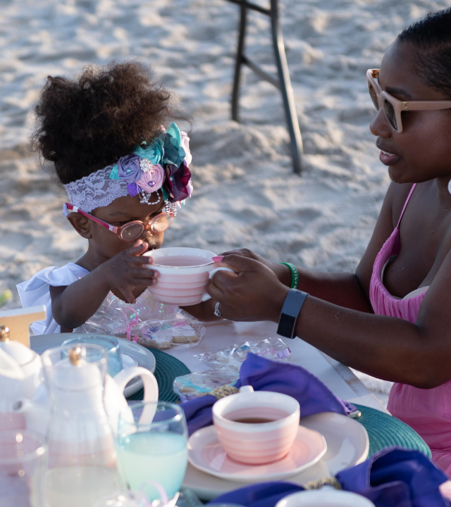 Nia has tea on the beach