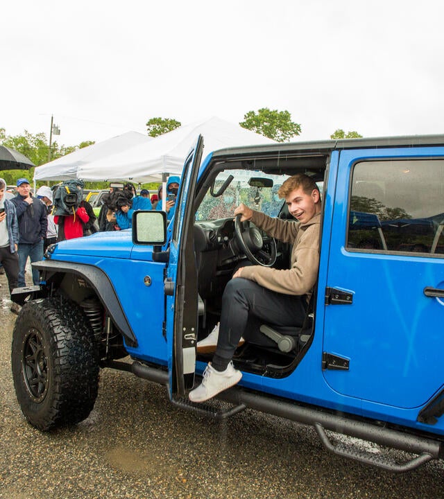 Andrew getting out of his made over Jeep