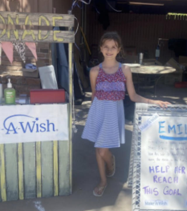 Emily hosted a lemonade stand and garage sale to raise money for wish kids. 