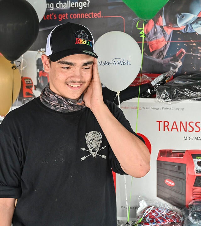 Noah looks in awe at all his new welding tools.