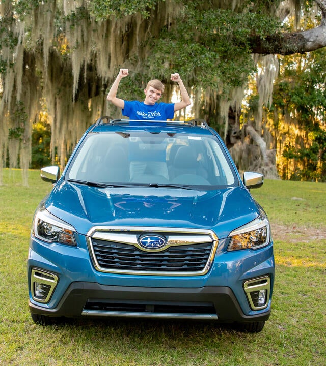 Wish kid Colton in Subaru Forrester