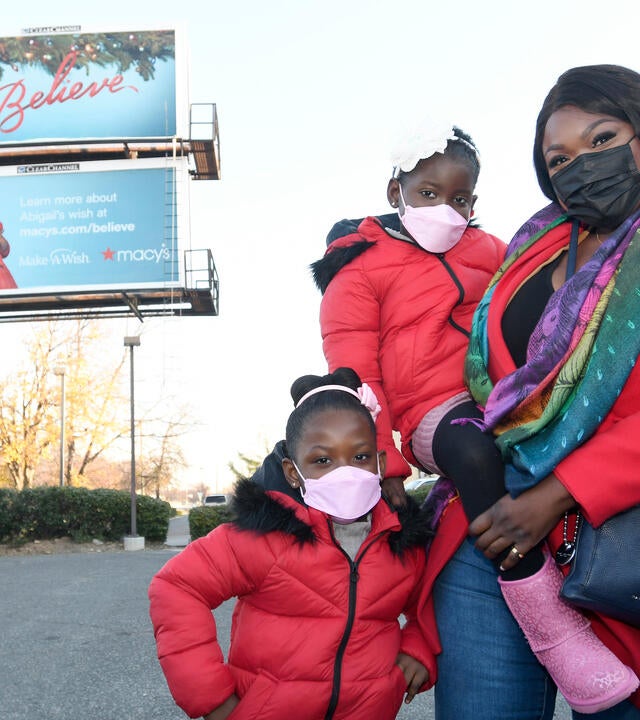 Abi, vivi, and their mom at Abi's billboard