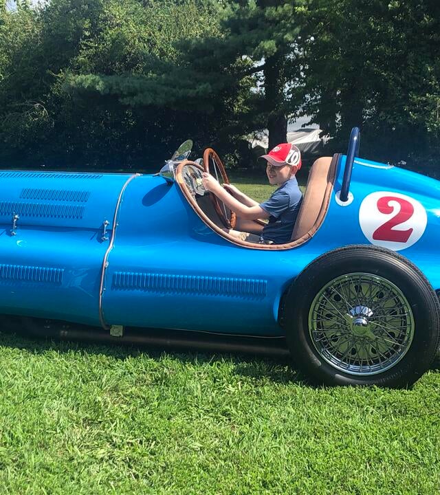 Declan in a vintage car