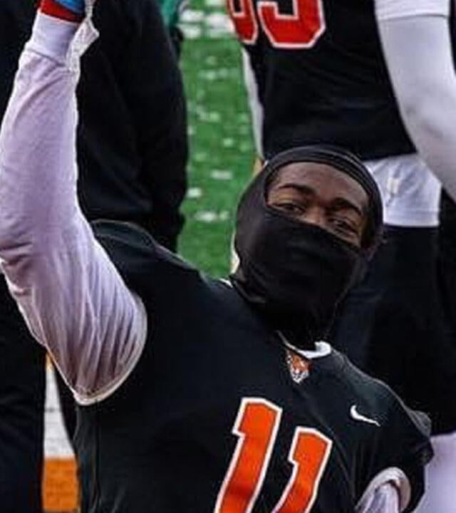 Tariq on a football field