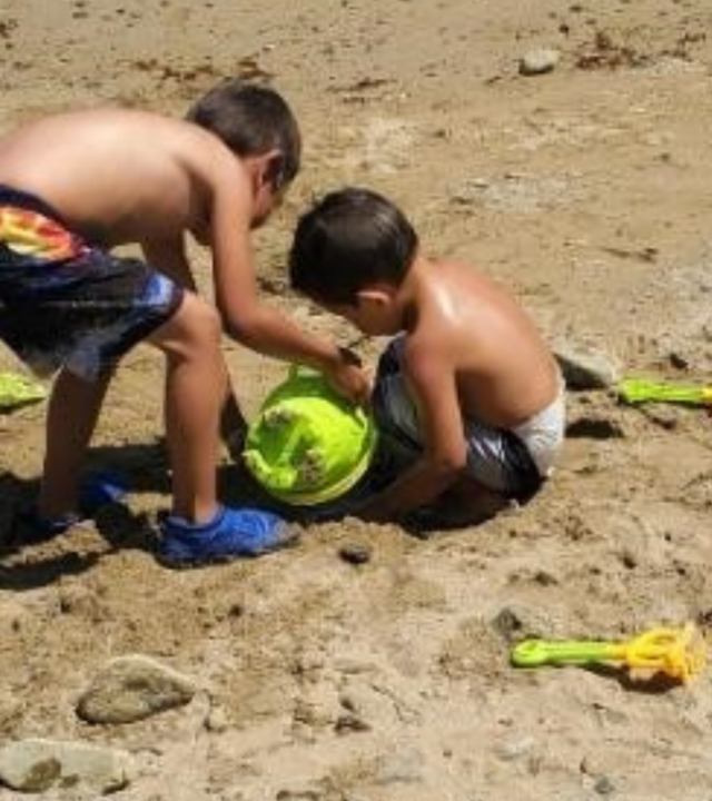 Leo and brother playing at the beach