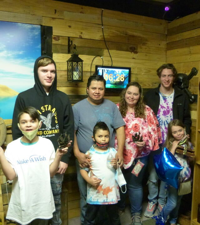 Wish kid Levi and his family enjoying their escape room surprise