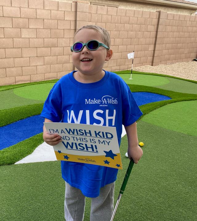 Wish kid Andrew was surprised with his wish to have a golf course