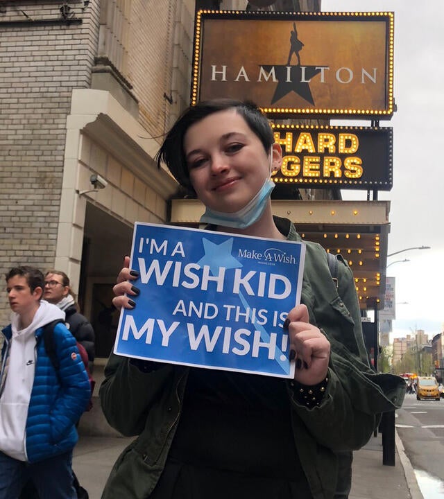 Madilynn outside of a Broadway theater on her wish day. 