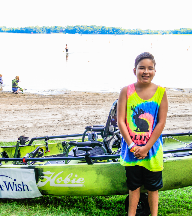 Nico in front of his kayak 