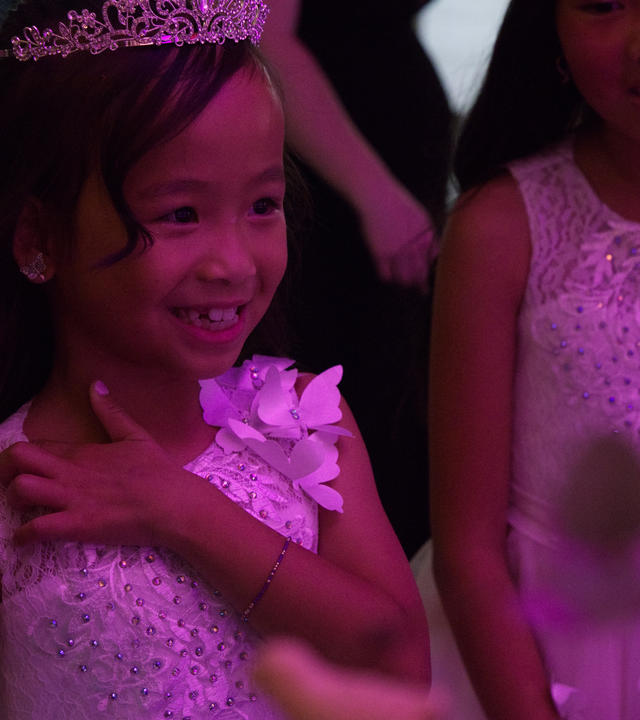 Wish kid Journi smiling wearing her princess dress and tiara