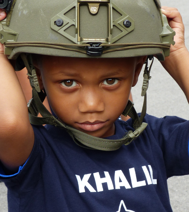 Wish child Khalil with police helmut