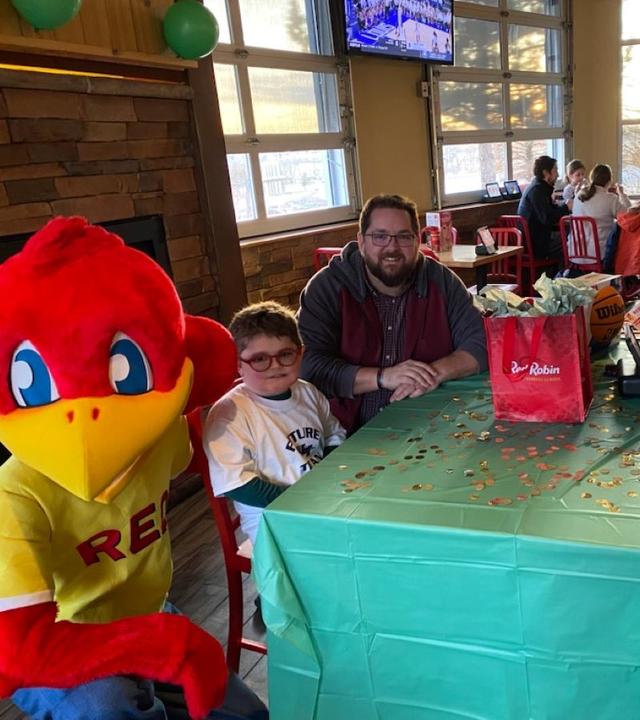 Andrew and his family at Red Robin