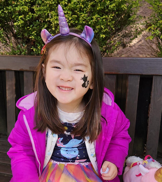 Wish Kid Lily on bench