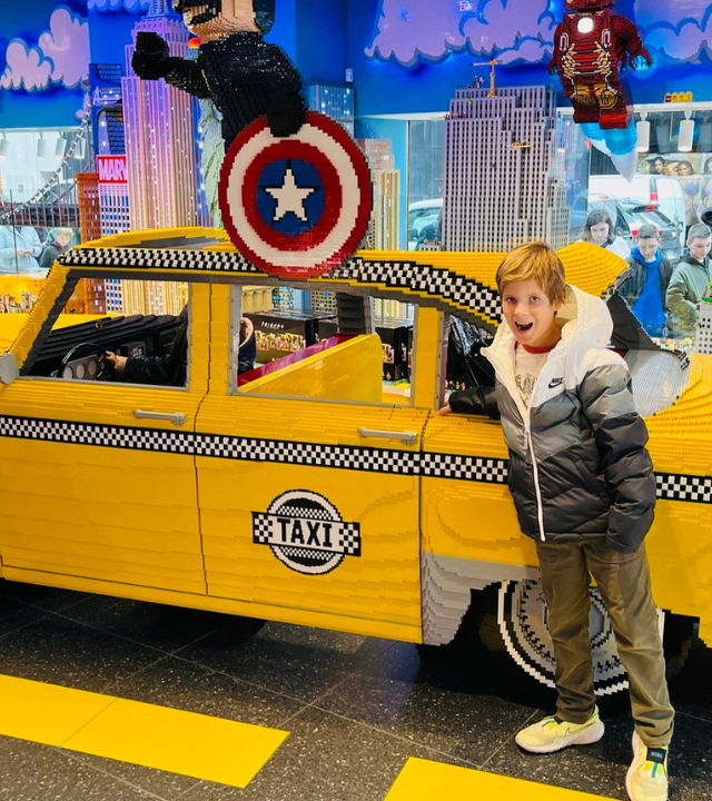 Wish kid Cameron at Lego store