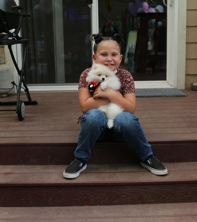 Cienna holding puppy