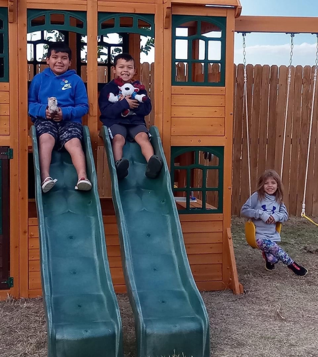 Neriah and siblings on playset
