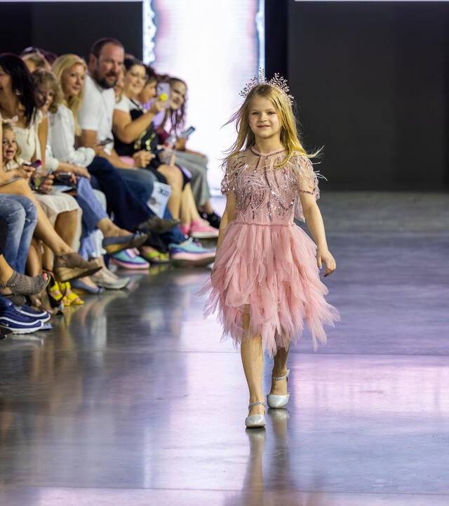 Lucy walks in a fashion show