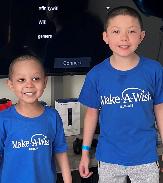 Kyree and his big brother smile on Kyree's wish day