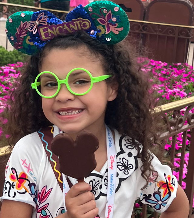 Wish child Avery smiling with her Mickey Mouse ears
