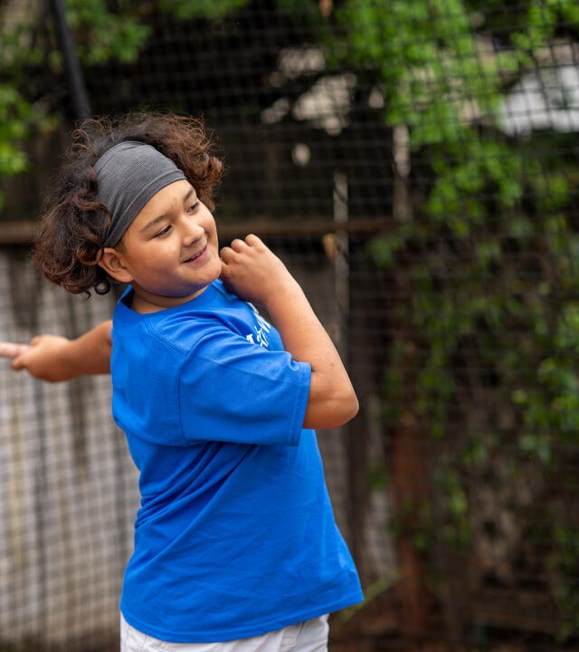 An action shot of Fernie right after he hit a pitch thrown at him
