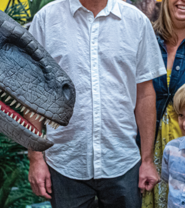 Dean greets a dinosaur