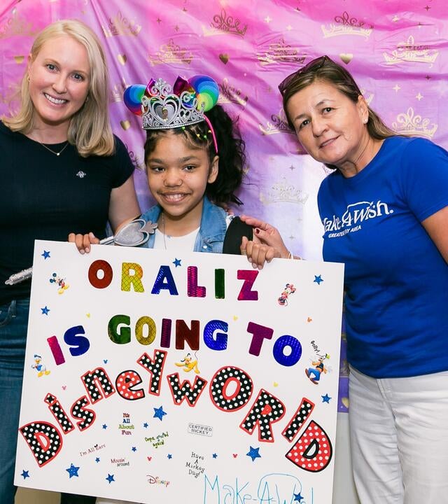 Pictured above: wish granter Alexis Monsees (left), wish kid Oraliz (center), and wish granter Ana Chowdhury (right) during her wish reveal.