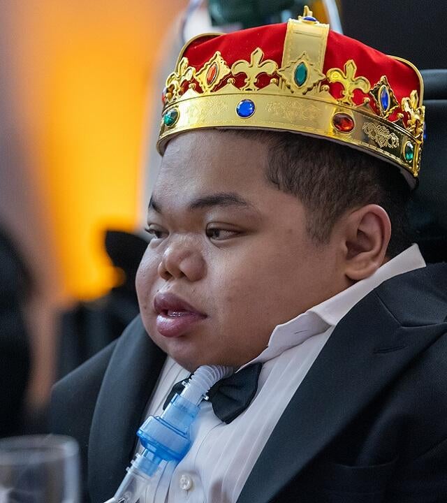 Matthew wearing crown at birthday party