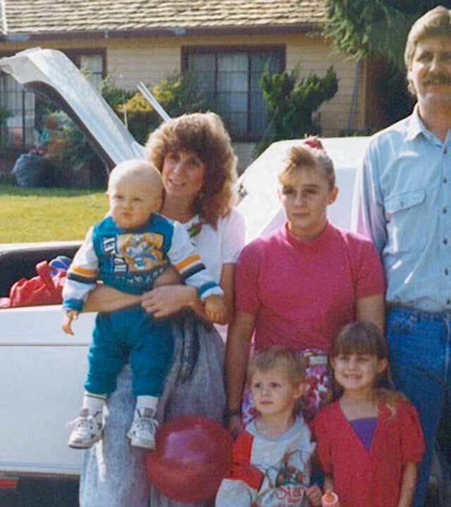 Wish kid Miles and family in front of a limo on the way to Disneyland