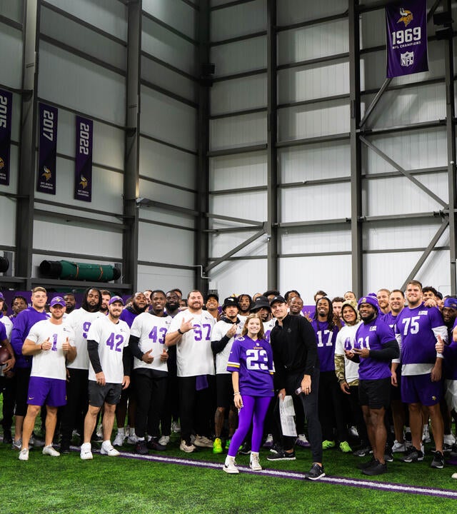 Minnesota Vikings with Make-A-Wish kid Sylvia take a group photo during her wish