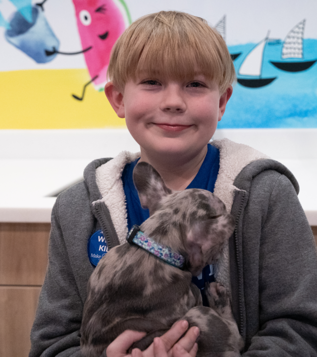 Jace holding Luna, his French bulldog puppy