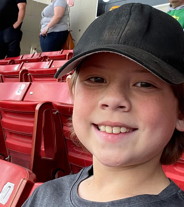 Seton sitting in a stadium — AKWA