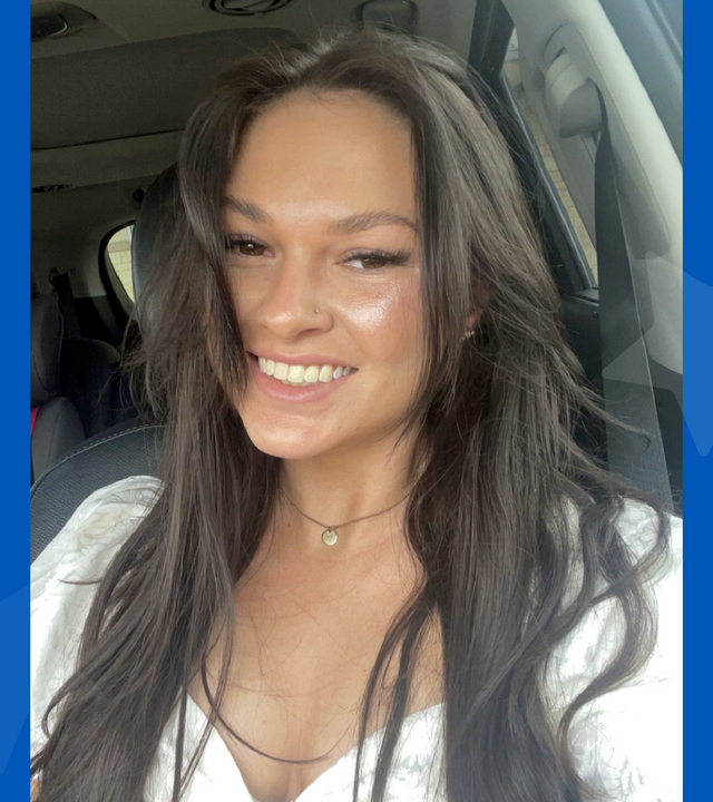 woman with long brown hair smiling