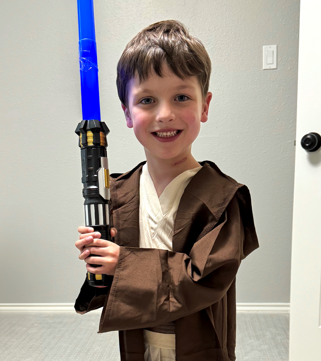 Boy dressed up as Luke Skywalker