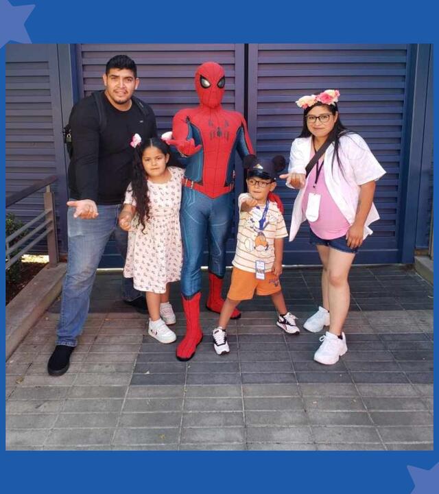 Leonel with his mom, Selene, dad, Alexis, and sister, Miranda with Spider-Man on his wish to go to Disneyland.