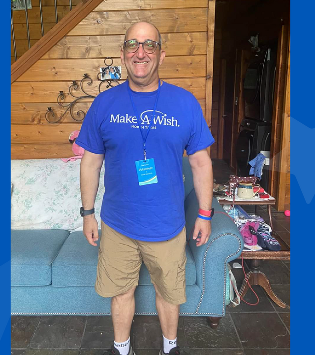 Man wearing Make-A-Wish North Texas shirt and khaki shorts