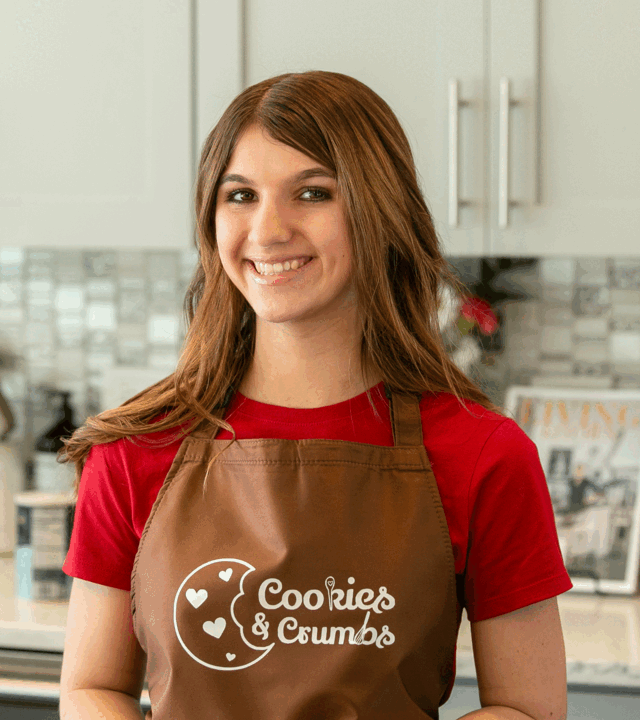 Neysa standing in her kitchen