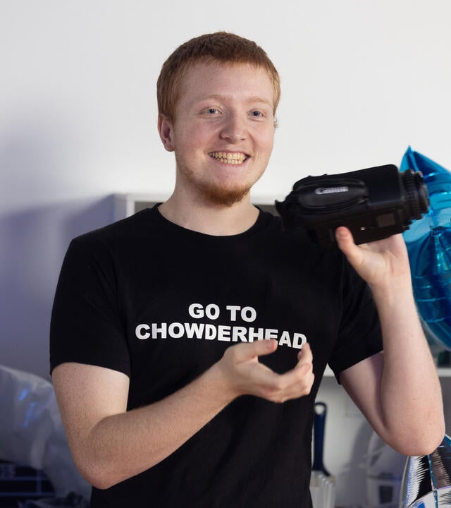 Hunter Smiling with a New Camera