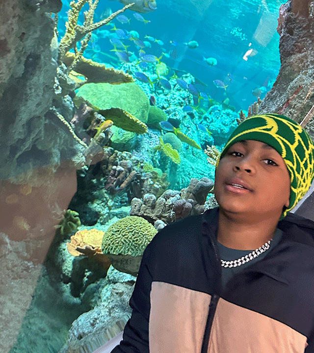 Messiah in front of fish tank