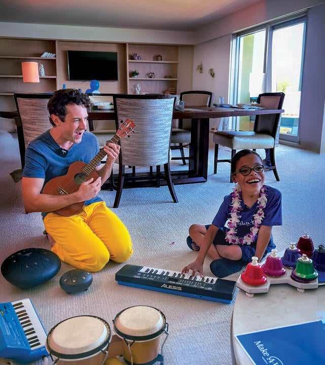 Atticus and Mr. Rob playing instruments and making music