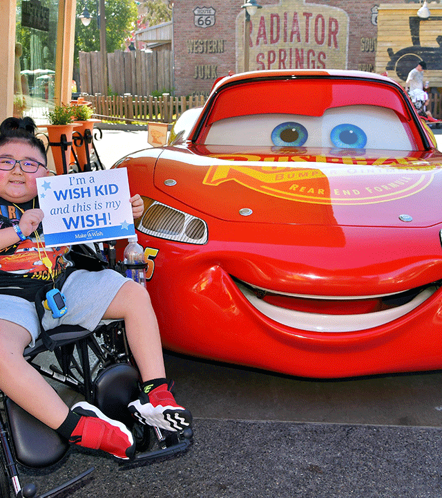 Liam next to Lightning McQueen